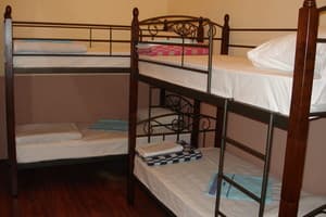 Хостел Voyage. Односпальная кровать в общем номере с 4 кроватями 3